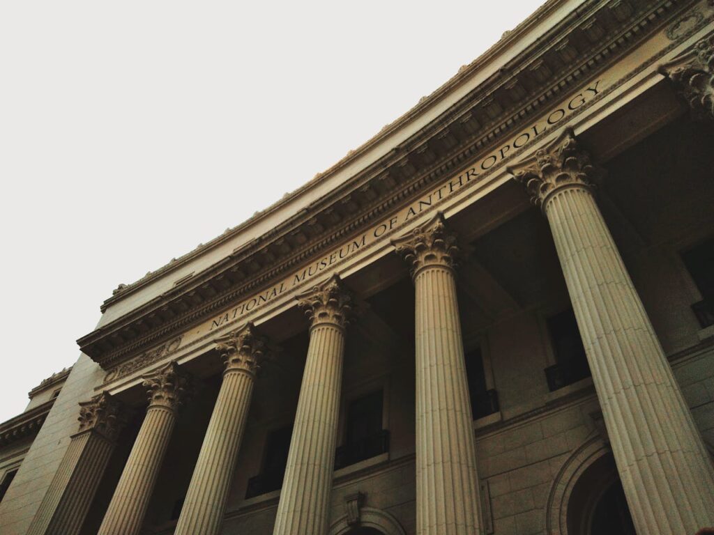 Low angle view of the historic neoclassical facade of the National Museum of Anthropology.